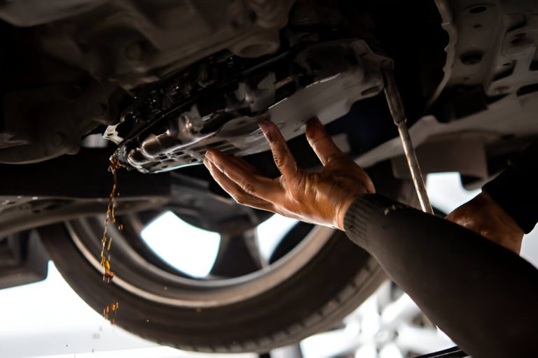 Car Mechanic Drain Automatic Transmission Fluid